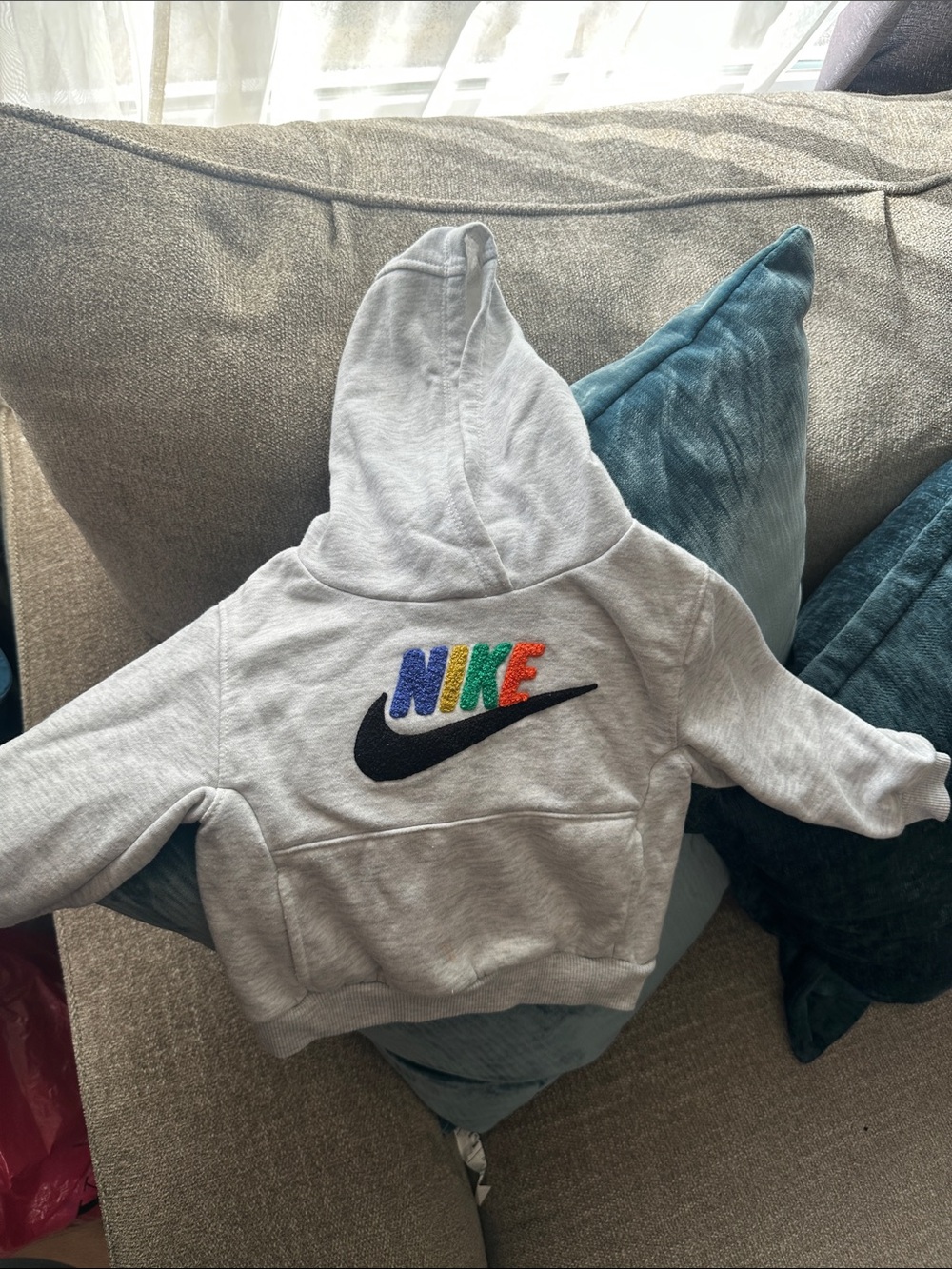 Nike Kids Light Gray Hoodie with Multicolor NIKE Letters and Black Swoosh